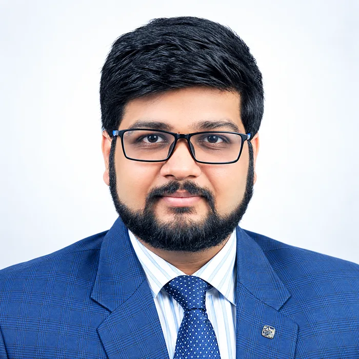 Portrait of Angad Kulkarni in a blue suit