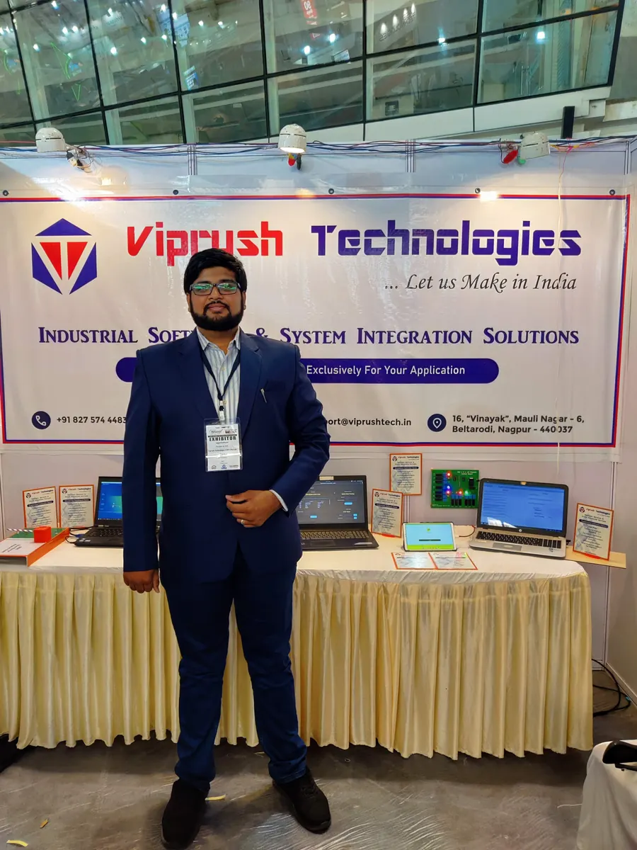 Angad Kulkarni standing at the Viprush Technologies exhibition stall